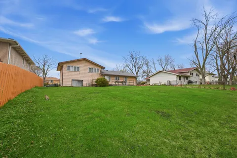 a view of a house with a big yard
