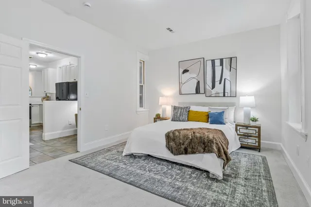 a bedroom with a bed and window