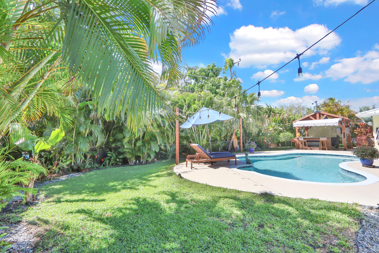 225 Orange Tree Drive Atlantis, FL 33462 - Photo 34 of 44 Lush Landscape