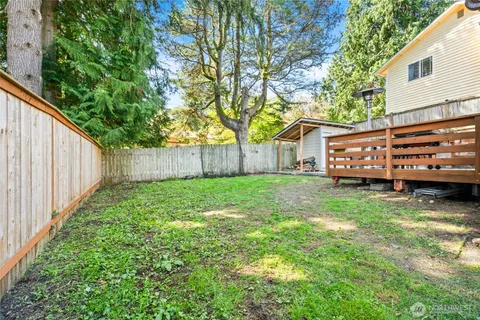 a view of a house with a back yard