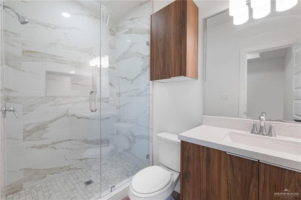 2900 Gabriel Street, Unit 3 Mission, TX 78574 - Photo 11 of 14 a bathroom with a sink a toilet and shower