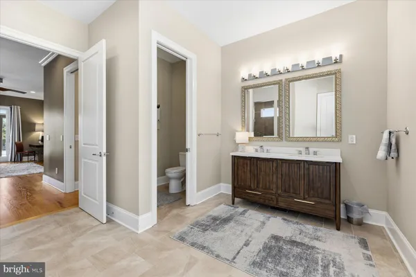 a utility room with dryer washer and empty racks
