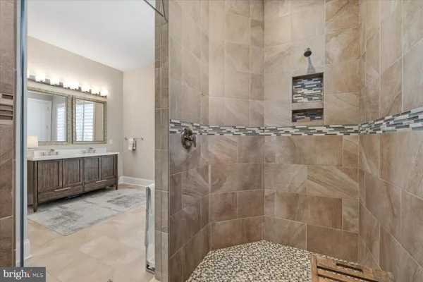 a bedroom with bed and a couch