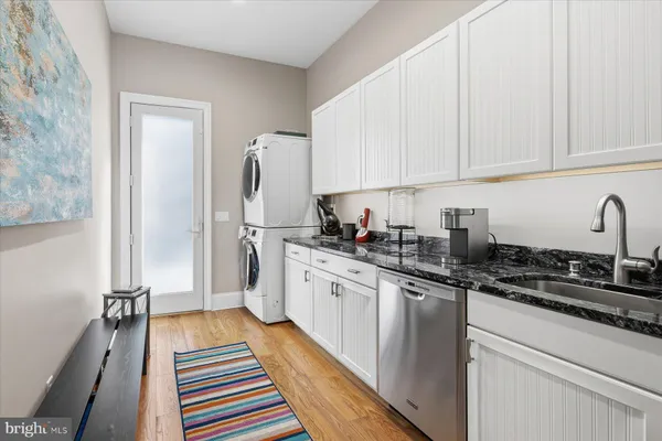 a bathroom with a toilet a sink and shower