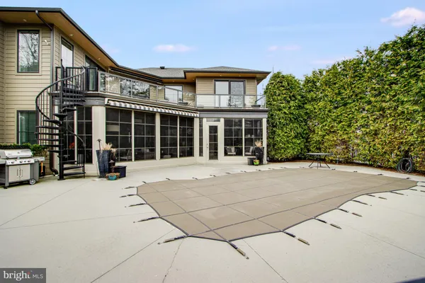 a kitchen with stainless steel appliances granite countertop a sink dishwasher a stove a refrigerator and island with wooden floor