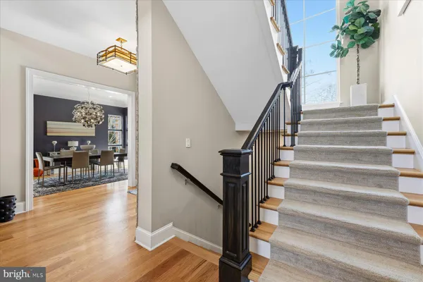 a bedroom with a bed a couch and a window