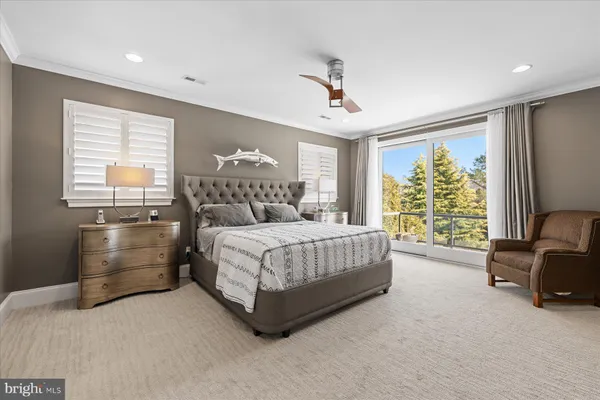 a living room with furniture and painting on the wall