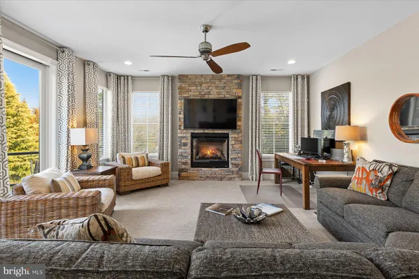 a bedroom with two beds and a large window