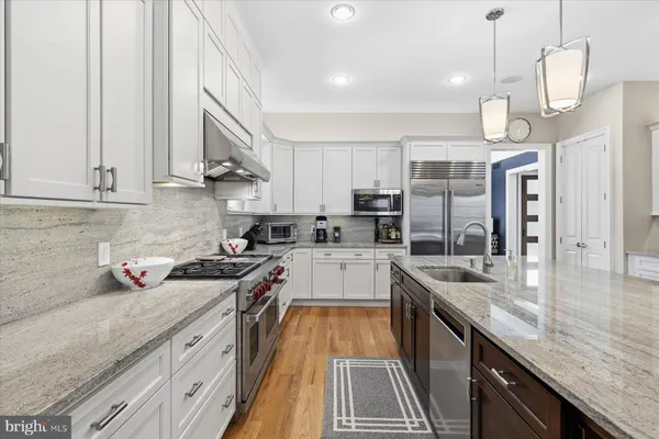 a living room with furniture and floor to ceiling windows