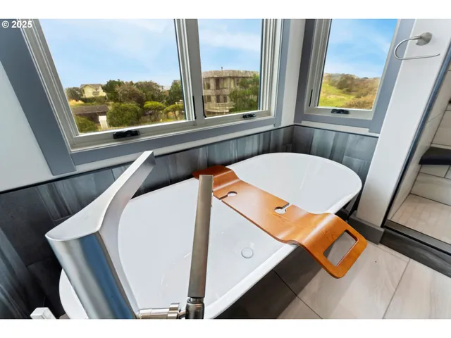 a view of a room with furniture and window