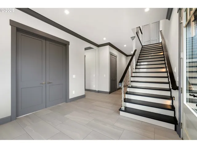 a view of a livingroom with stairs and stairs