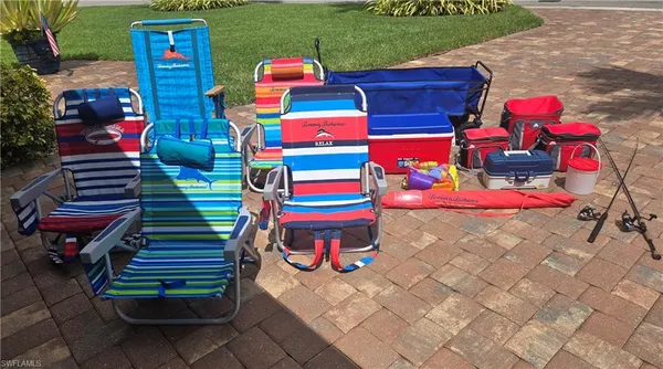 a backyard of a house with seating space and stainless steel appliances