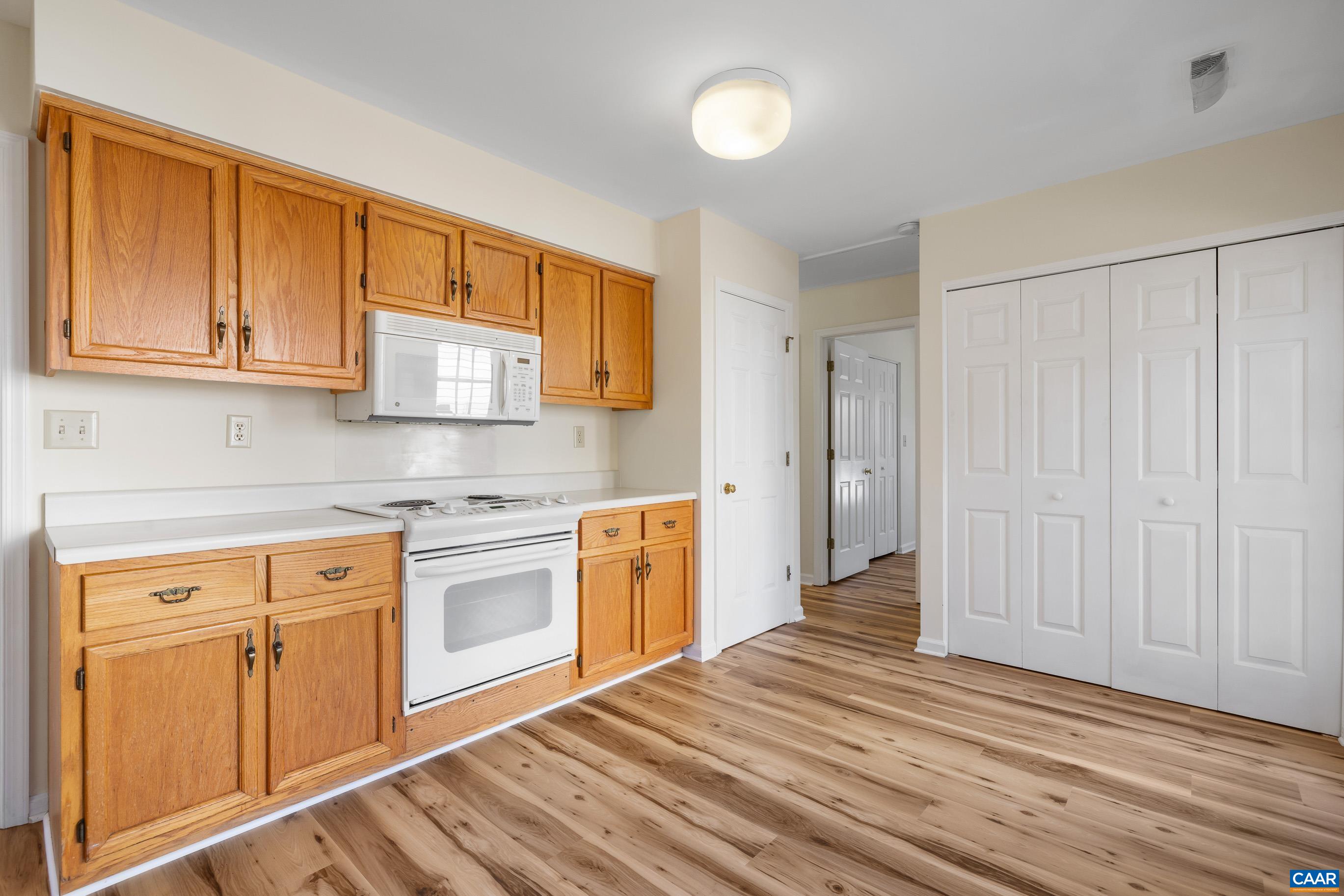 3041 Copper Knoll Road Charlottesville, VA 22911 - Photo 11 of 30 a kitchen with stainless steel appliances granite countertop a stove and a sink