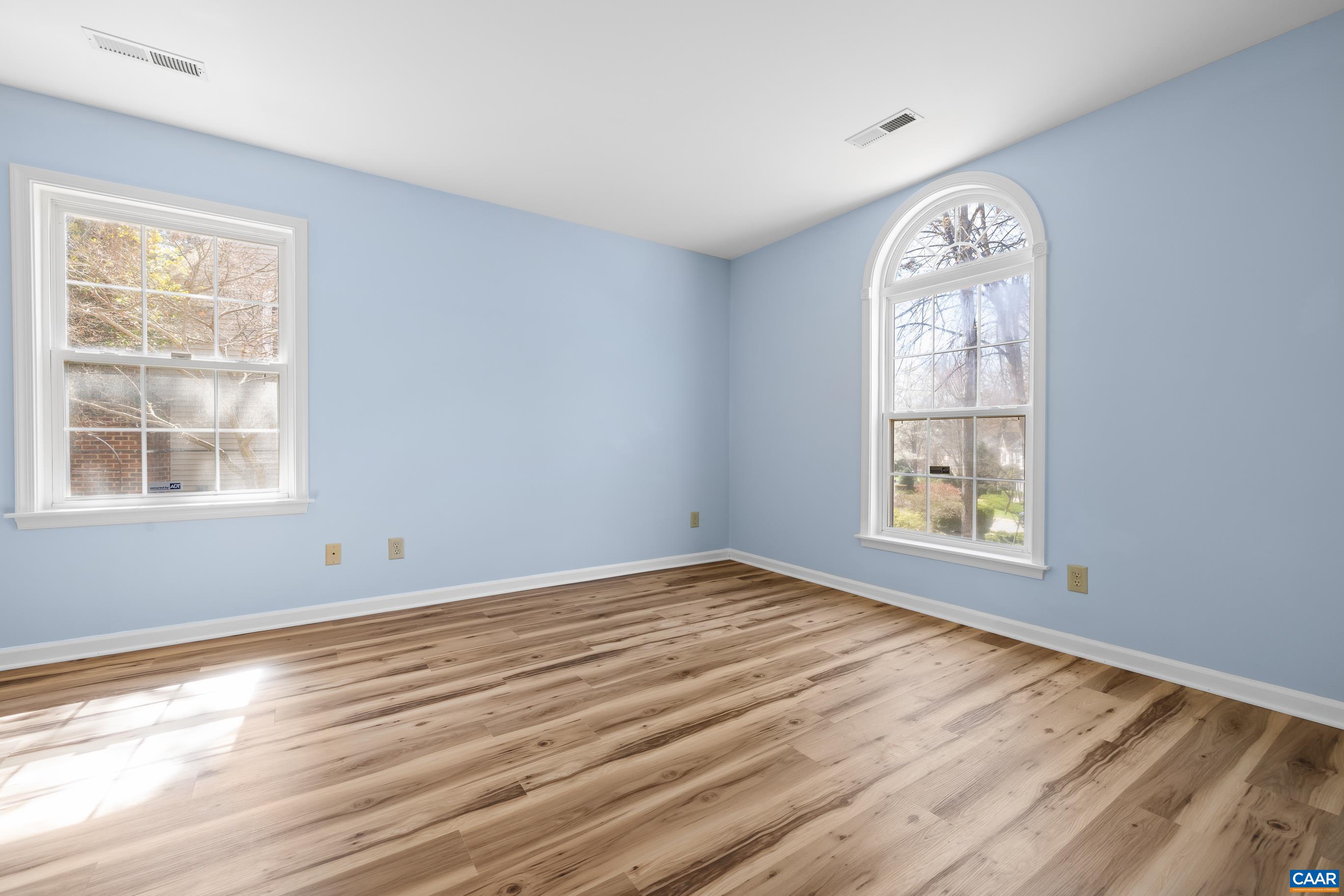 3041 Copper Knoll Road Charlottesville, VA 22911 - Photo 16 of 30 a view of an empty room with wooden floor and a window