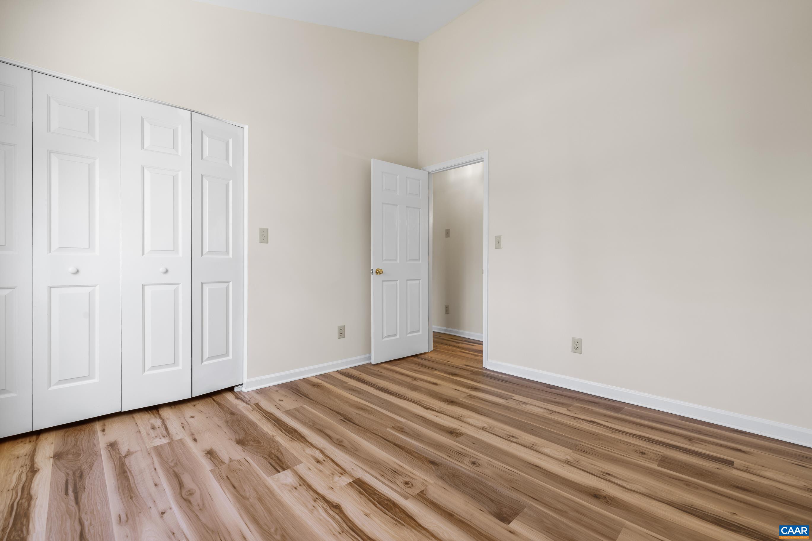 3041 Copper Knoll Road Charlottesville, VA 22911 - Photo 21 of 30 a view of a room with wooden floor