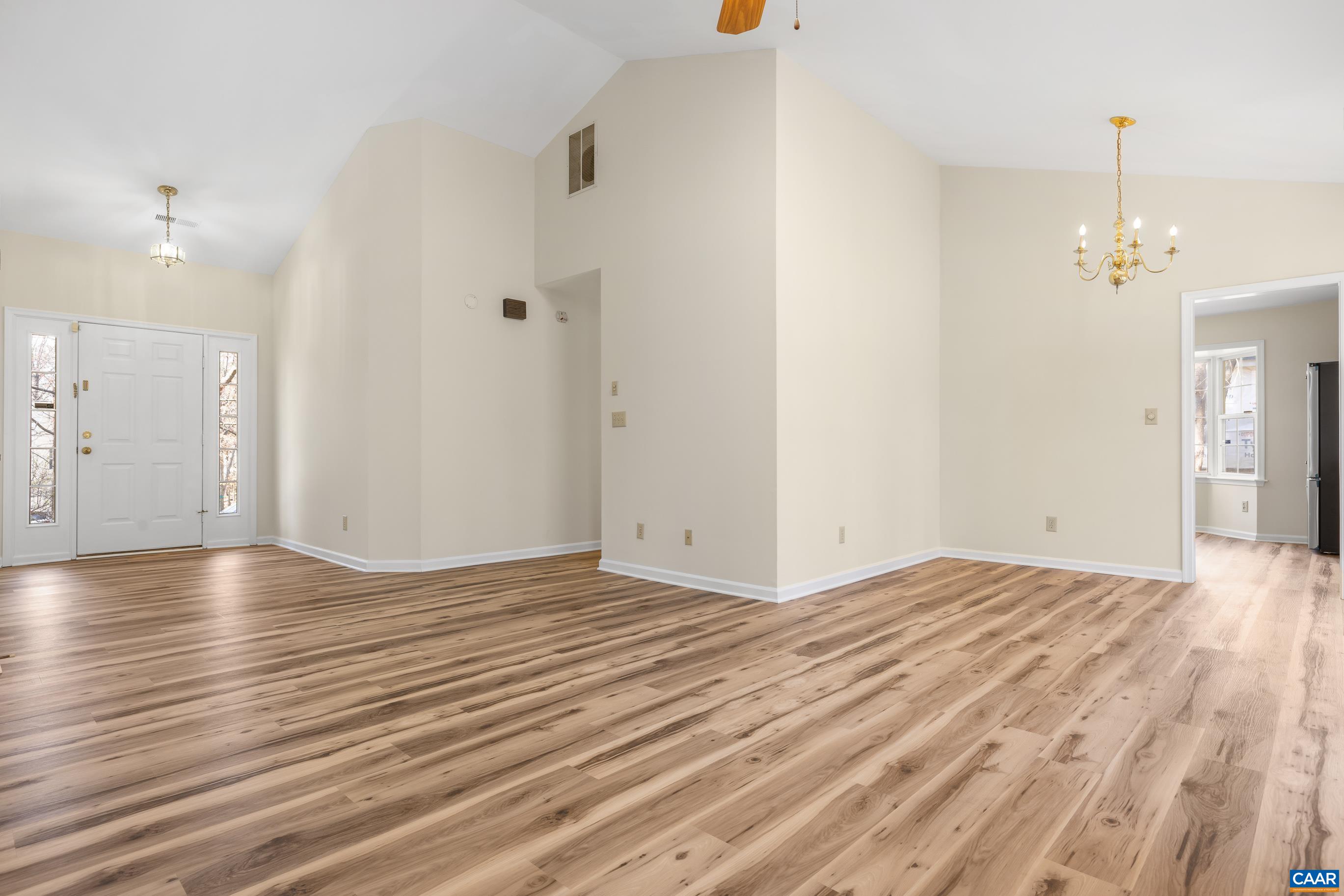 3041 Copper Knoll Road Charlottesville, VA 22911 - Photo 5 of 30 a view of empty room with wooden floor and fan