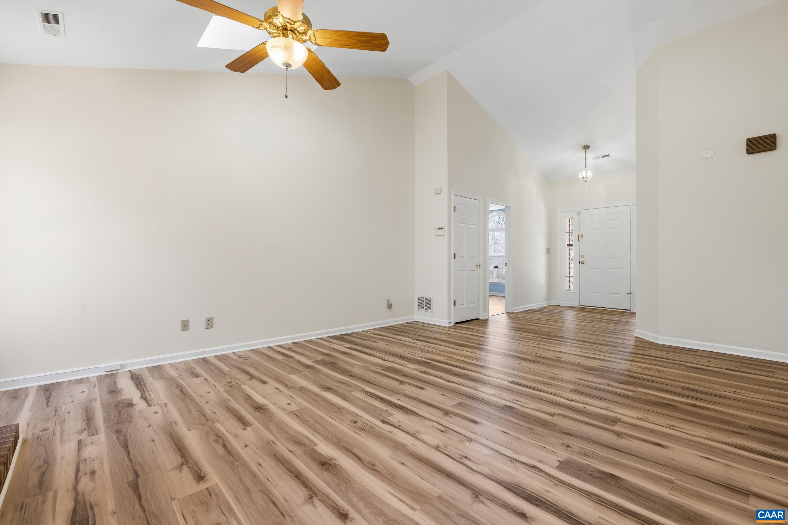 3041 Copper Knoll Road Charlottesville, VA 22911 - Photo 6 of 30 a view of empty room with wooden floor