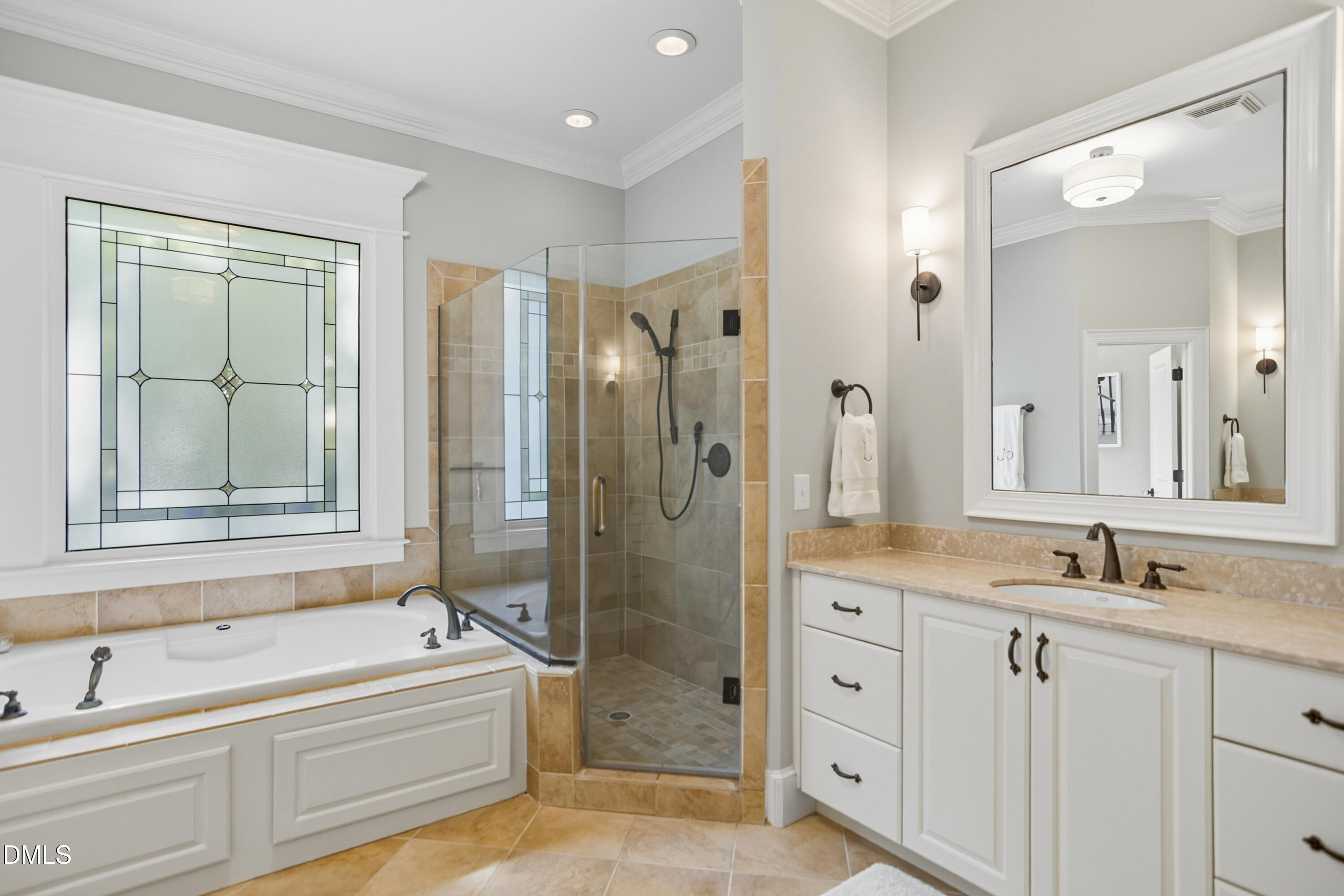 1409 Caistor Lane Raleigh, NC 27614 - Photo 20 of 46 a bathroom with a granite countertop tub shower sink and mirror