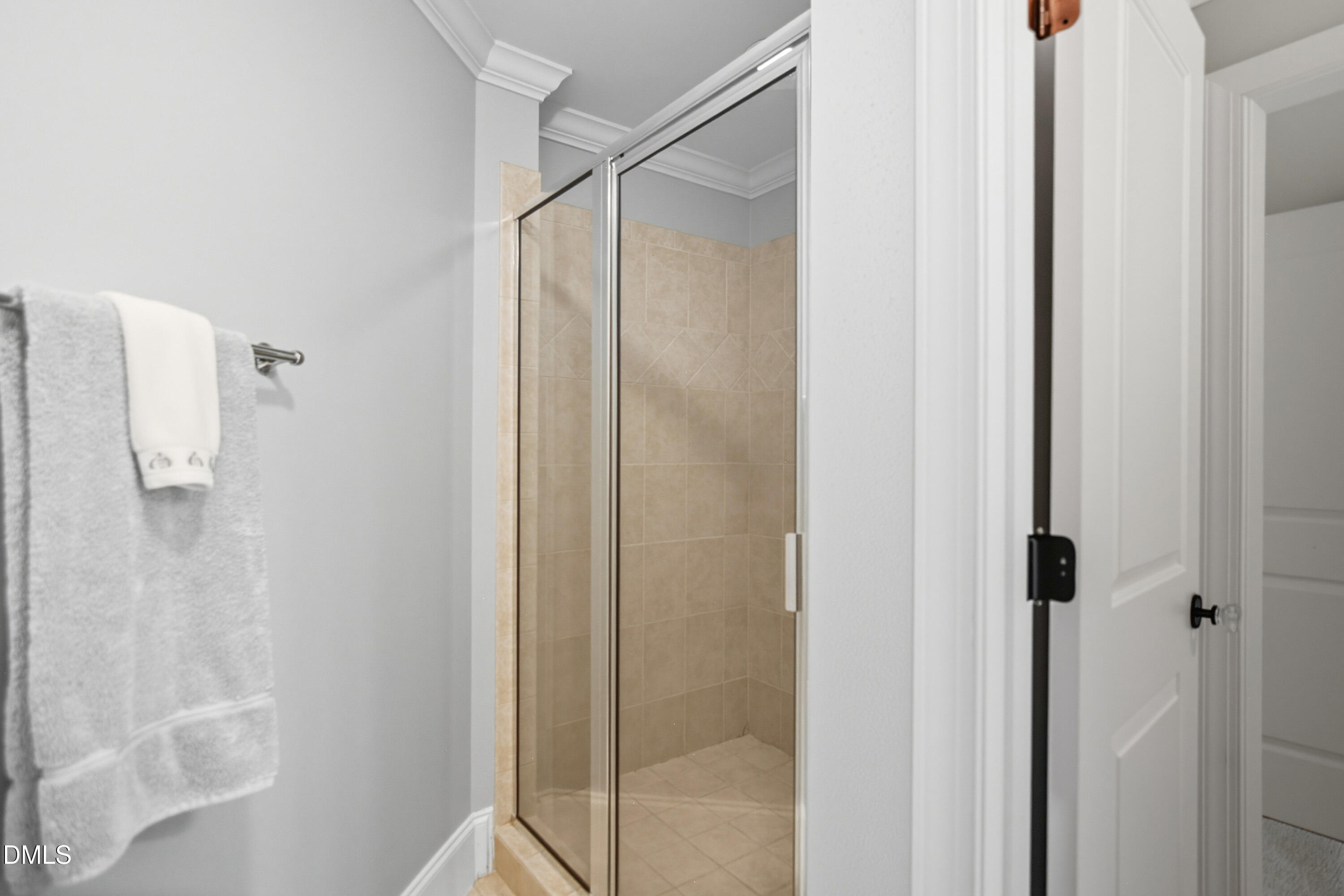 1409 Caistor Lane Raleigh, NC 27614 - Photo 26 of 46 a bathroom with a glass shower door
