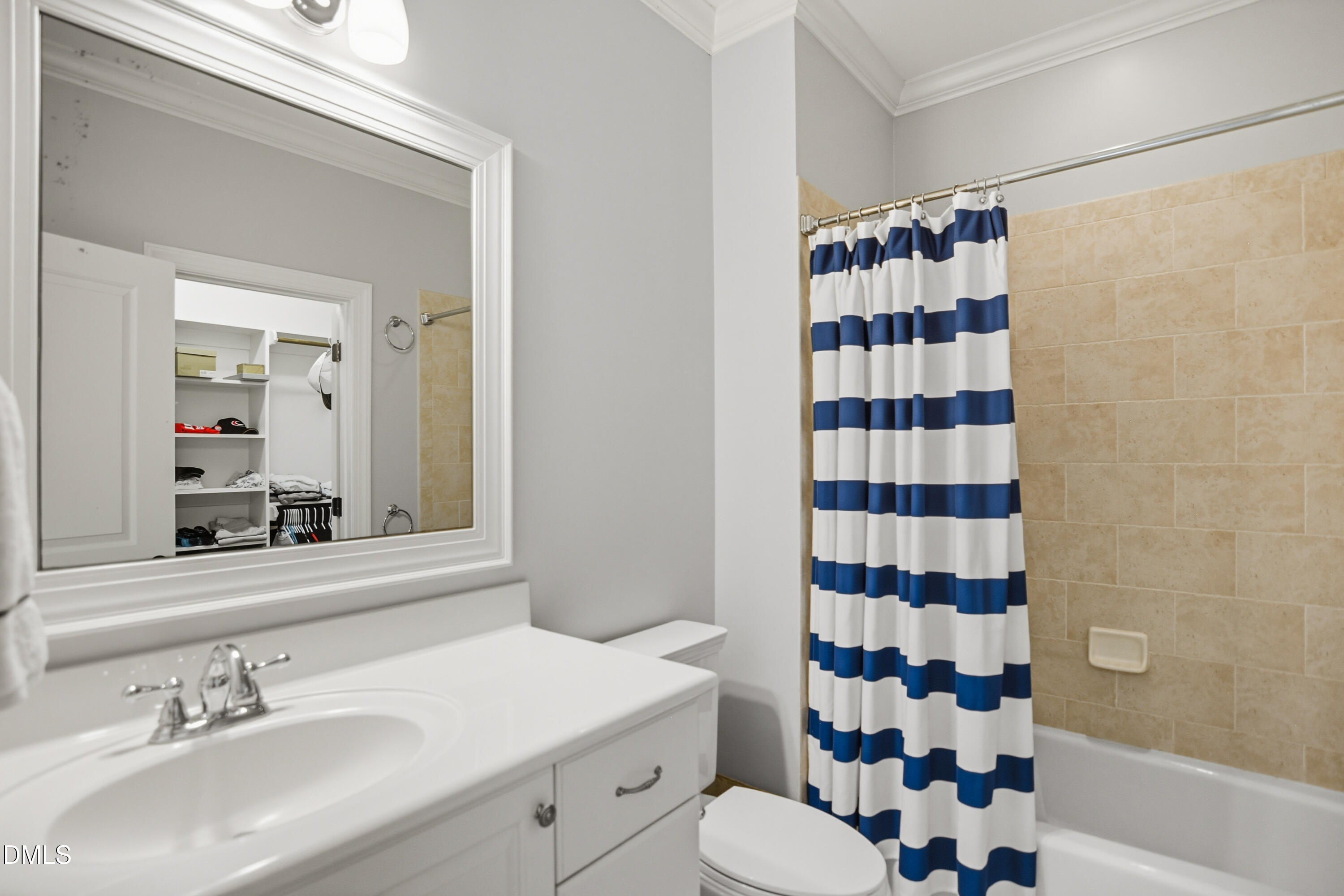 1409 Caistor Lane Raleigh, NC 27614 - Photo 27 of 46 a bathroom with a sink a toilet and shower curtain
