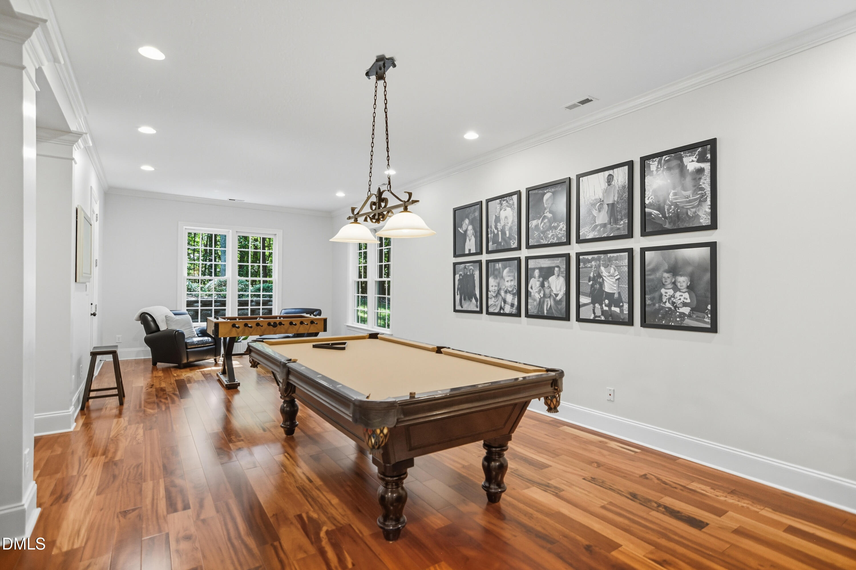 1409 Caistor Lane Raleigh, NC 27614 - Photo 34 of 46 a living room with furniture pool table and a wooden floor