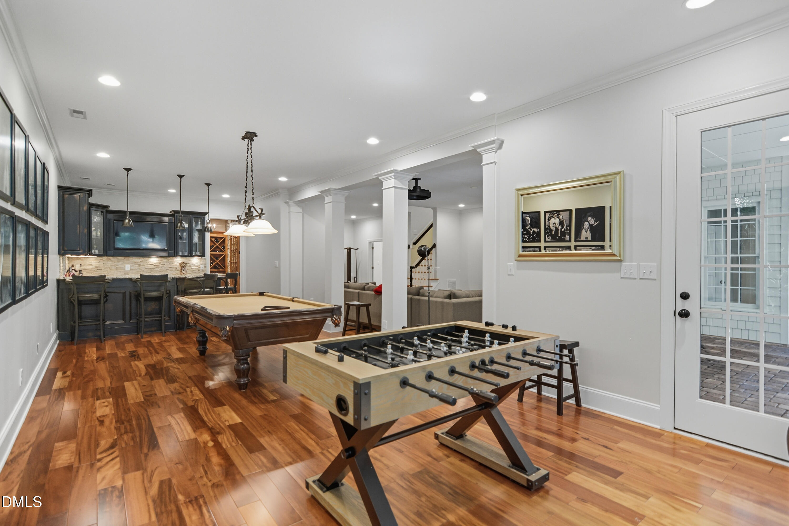 1409 Caistor Lane Raleigh, NC 27614 - Photo 35 of 46 a kitchen with stainless steel appliances granite countertop a stove a refrigerator a sink a dining table and chairs with wooden floor