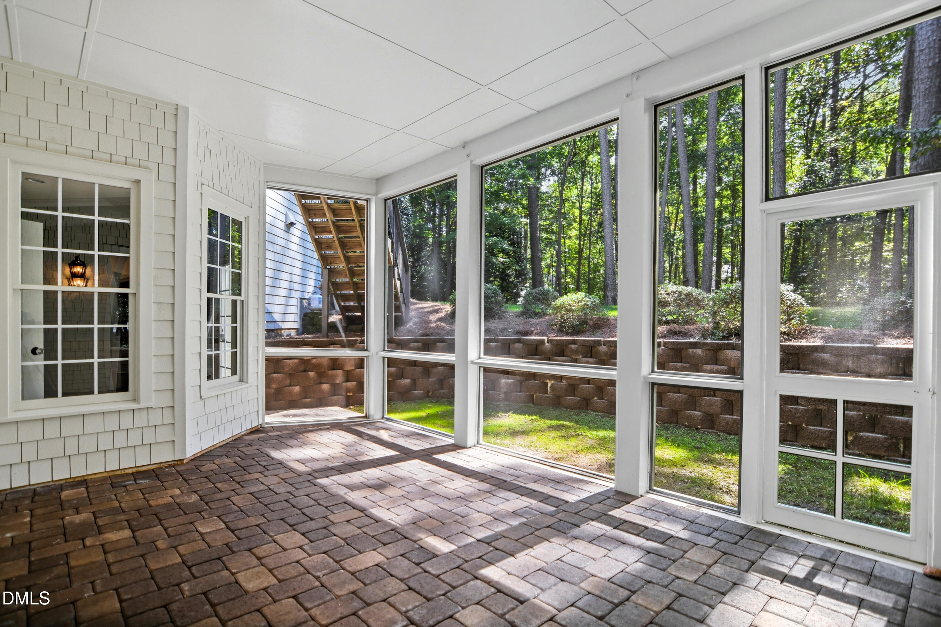 1409 Caistor Lane Raleigh, NC 27614 - Photo 41 of 46 a view of a backyard with floor to ceiling window and an outdoor view