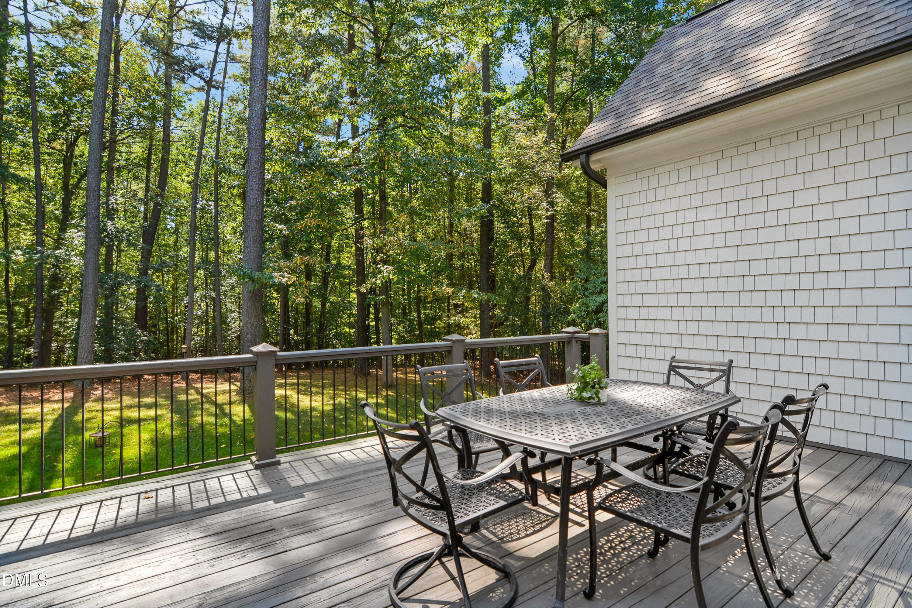 1409 Caistor Lane Raleigh, NC 27614 - Photo 42 of 46 a view of a chairs and table on the deck