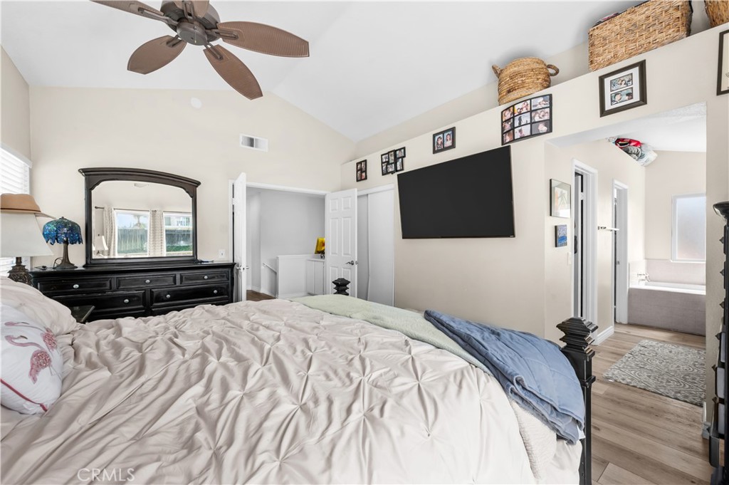 19465 Kinnow Lane Riverside, CA 92508 - Photo 25 of 61 a bedroom with a bed and a flat screen tv