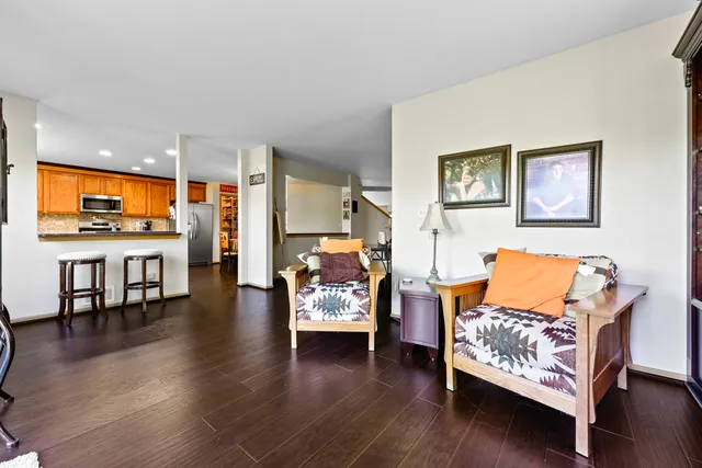 a bedroom with a bed and a flat tv screen on the dresser