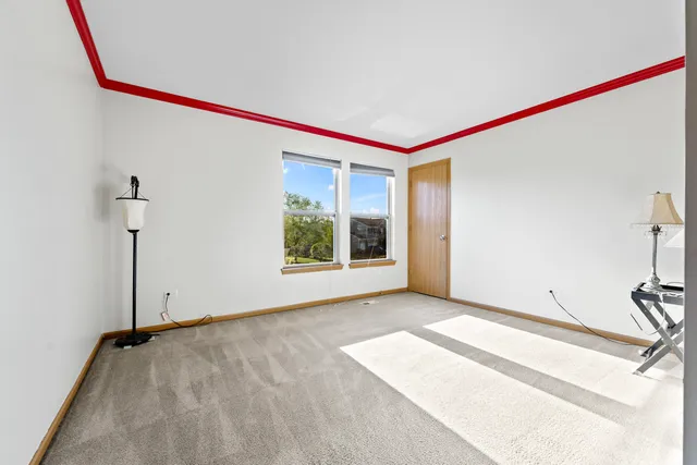 a bathroom with a sink a toilet and a large mirror