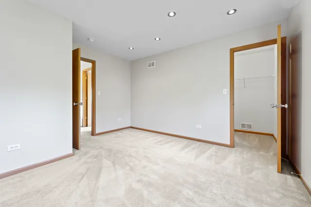 a big room with lots of furniture and a projector