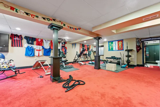 a front view of house with a garden and patio