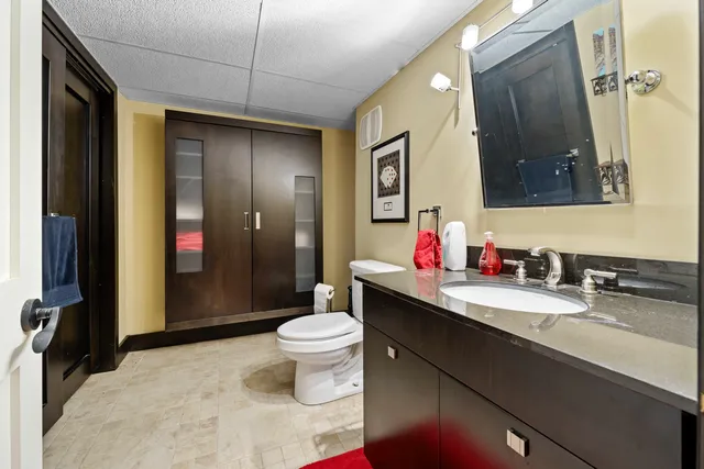 a front view of a house with a yard and fountain