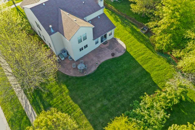 a view of a house with garden and yard