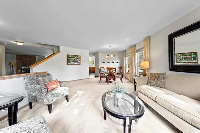 a living room with furniture and a table