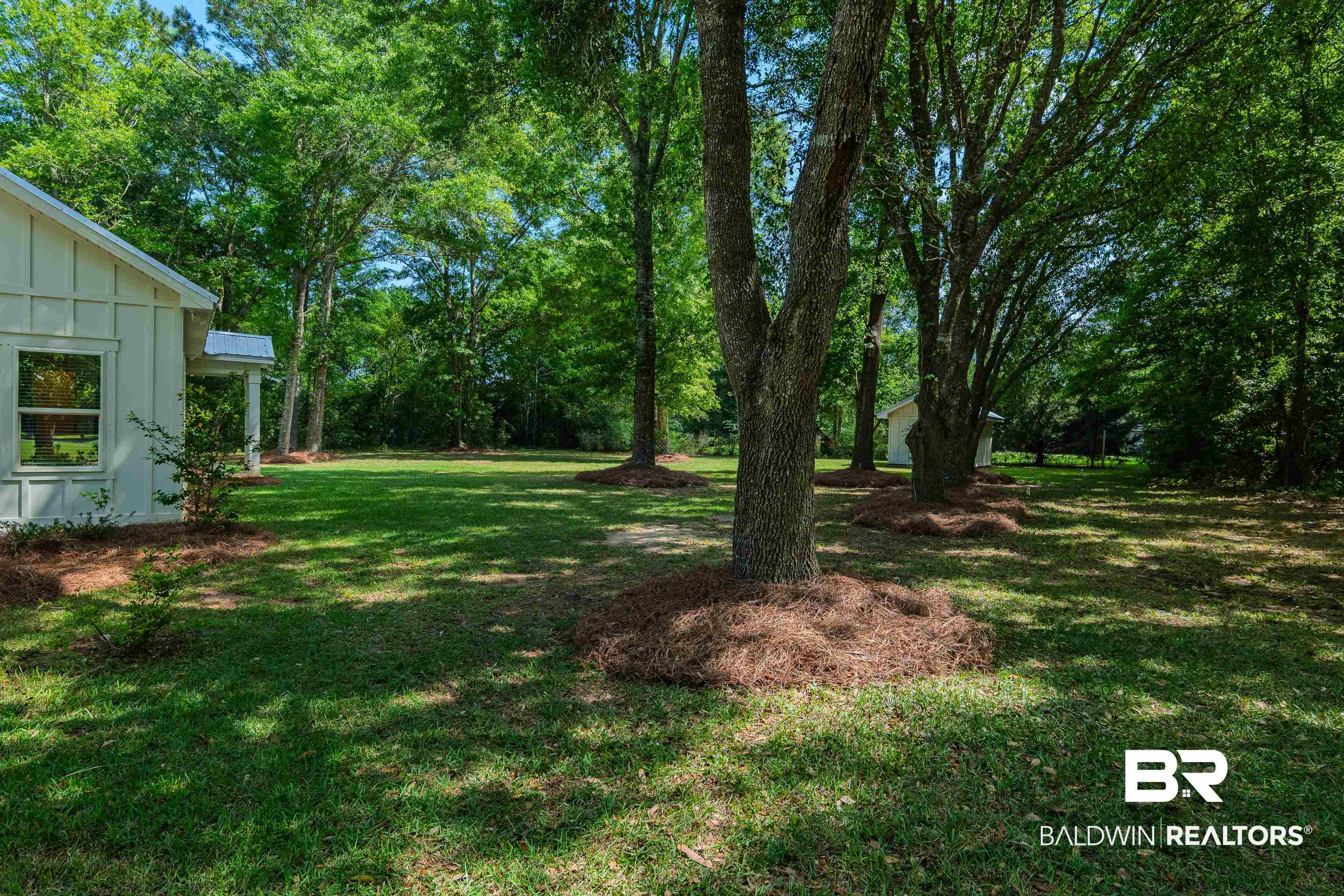19121 Boothe Road Fairhope, AL 36532 - Photo 31 of 41 View of green lawn with view of wooded area