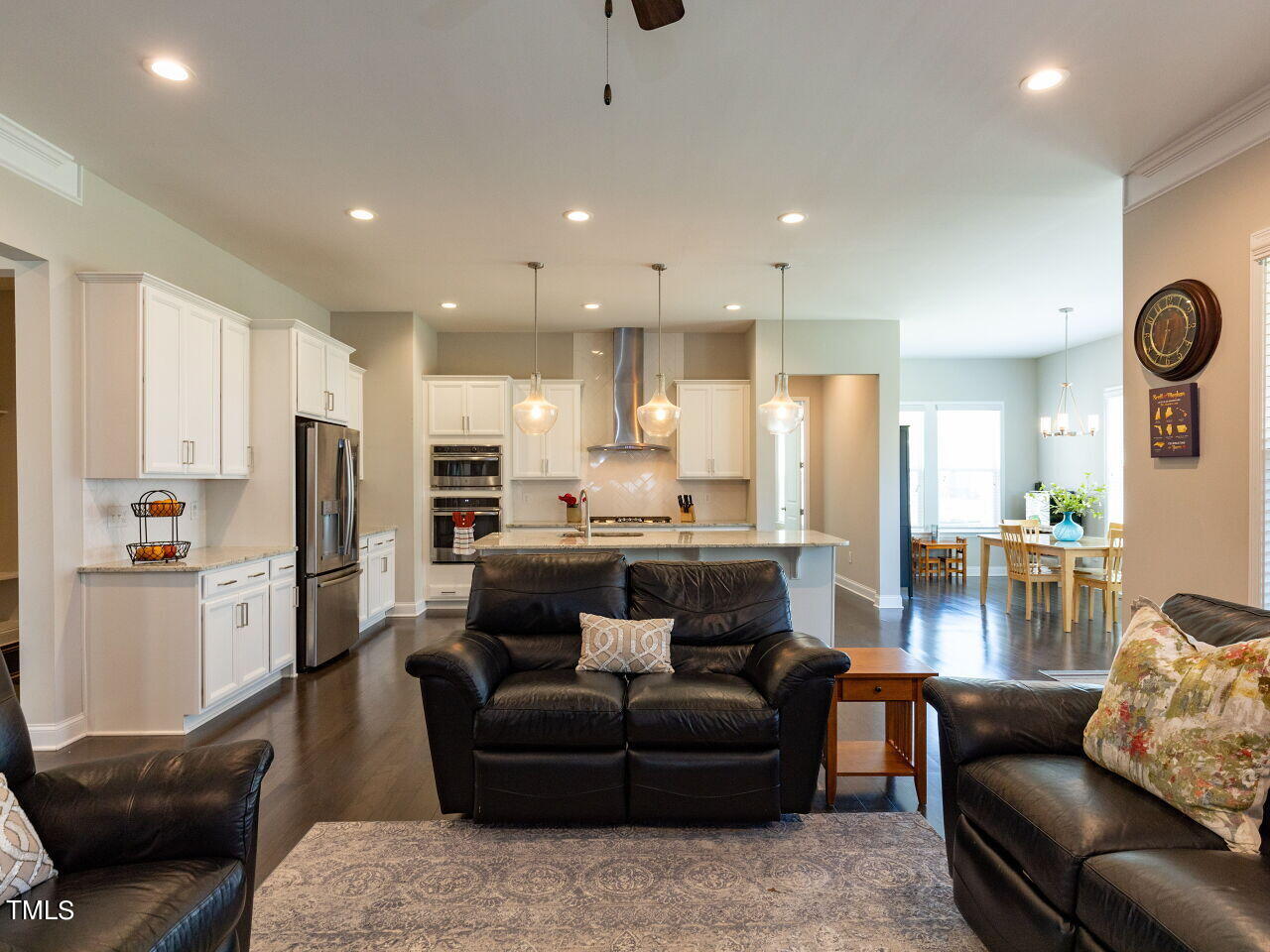 605 White Oak Pond Road Apex, NC 27523 - Photo 13 of 46 a living room with furniture and kitchen view