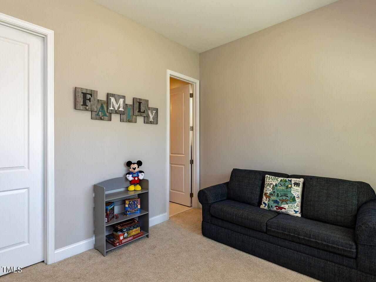 605 White Oak Pond Road Apex, NC 27523 - Photo 17 of 46 a living room with furniture and a baby crib
