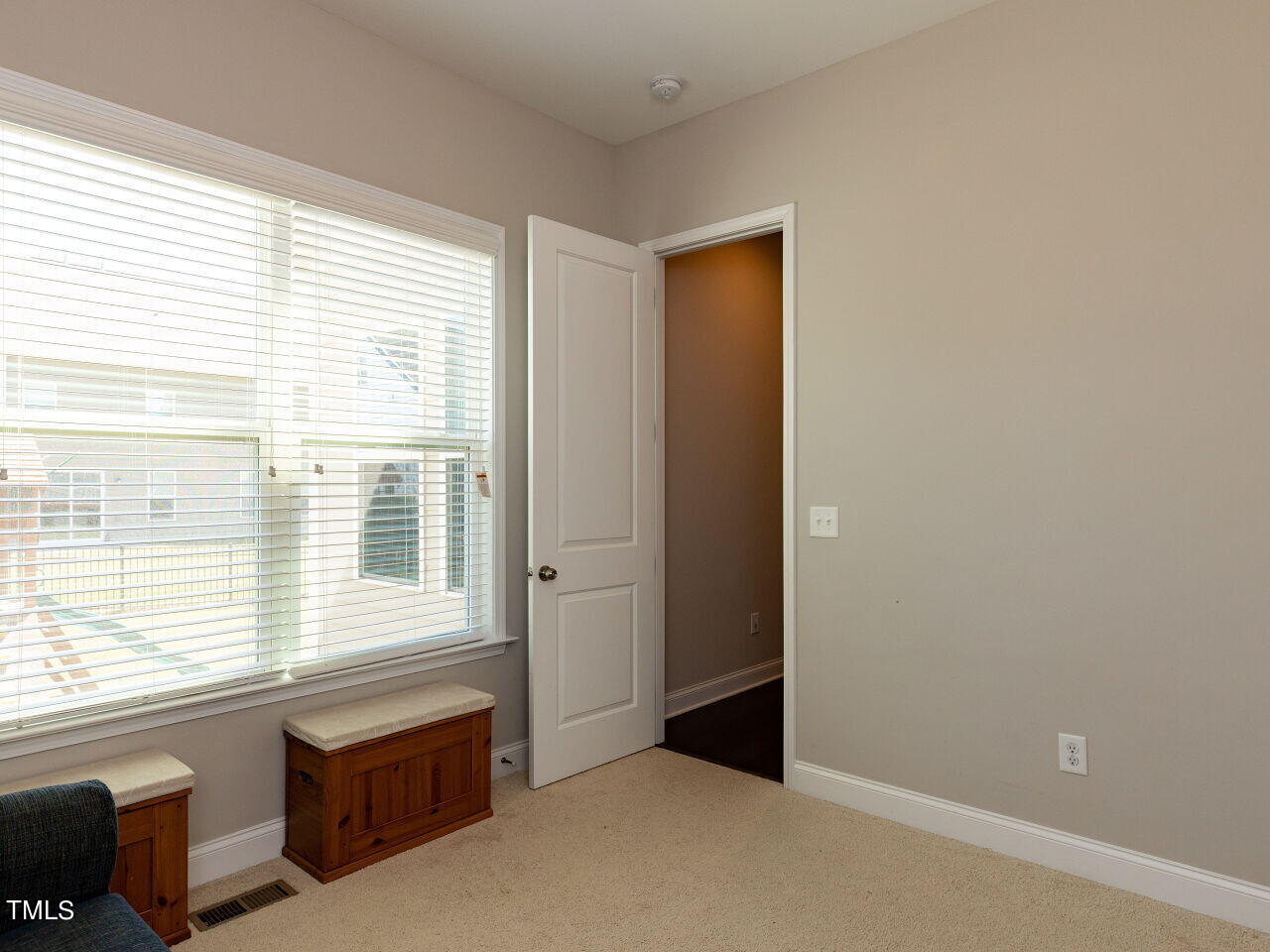 605 White Oak Pond Road Apex, NC 27523 - Photo 19 of 46 an empty room with windows
