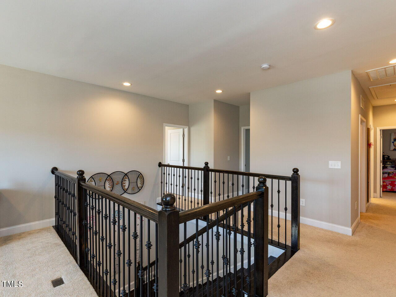 605 White Oak Pond Road Apex, NC 27523 - Photo 20 of 46 a view of a hallway with bed and door