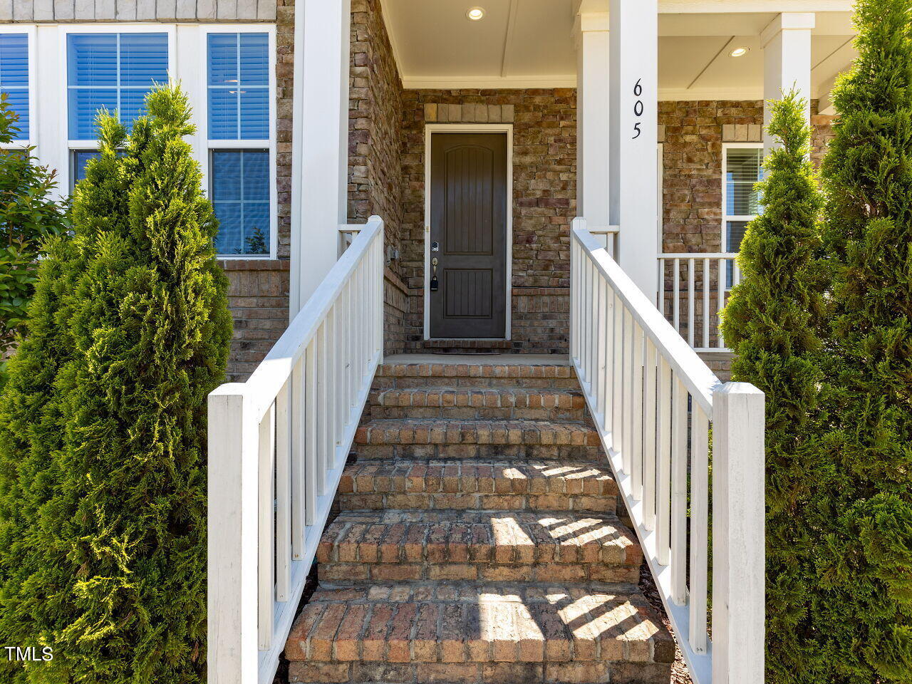 605 White Oak Pond Road Apex, NC 27523 - Photo 2 of 46 a view of balcony with wooden floor and fence