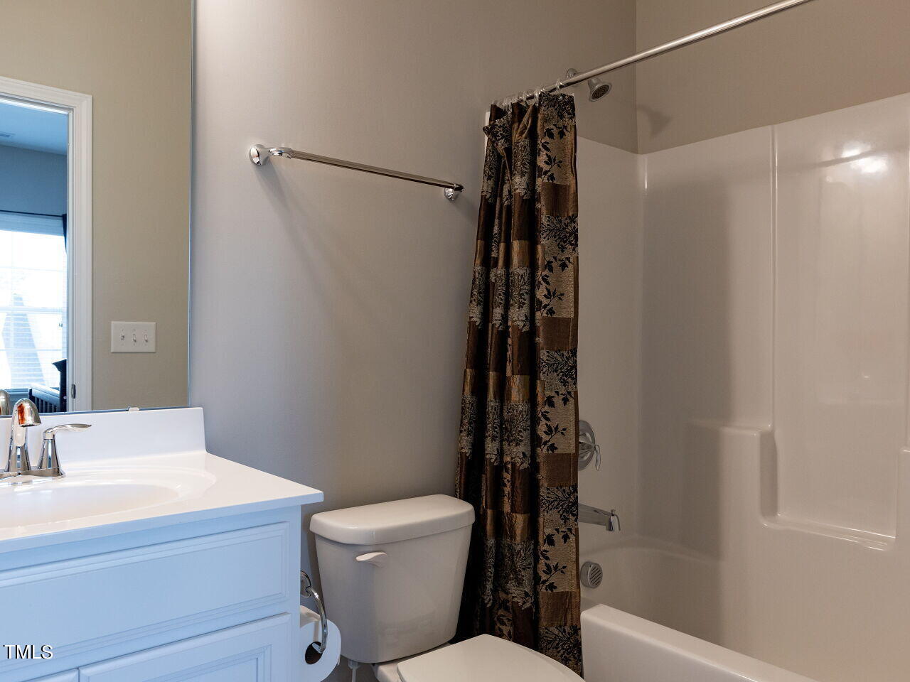 605 White Oak Pond Road Apex, NC 27523 - Photo 29 of 46 a bathroom with a shower toilet and sink