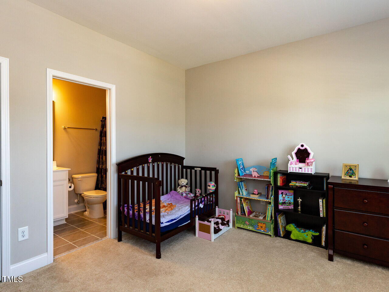 605 White Oak Pond Road Apex, NC 27523 - Photo 30 of 46 a view of kids room with toys and a baby crib
