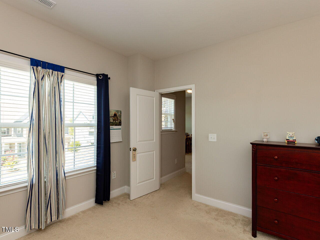 605 White Oak Pond Road Apex, NC 27523 - Photo 31 of 46 a view of an empty room with a window