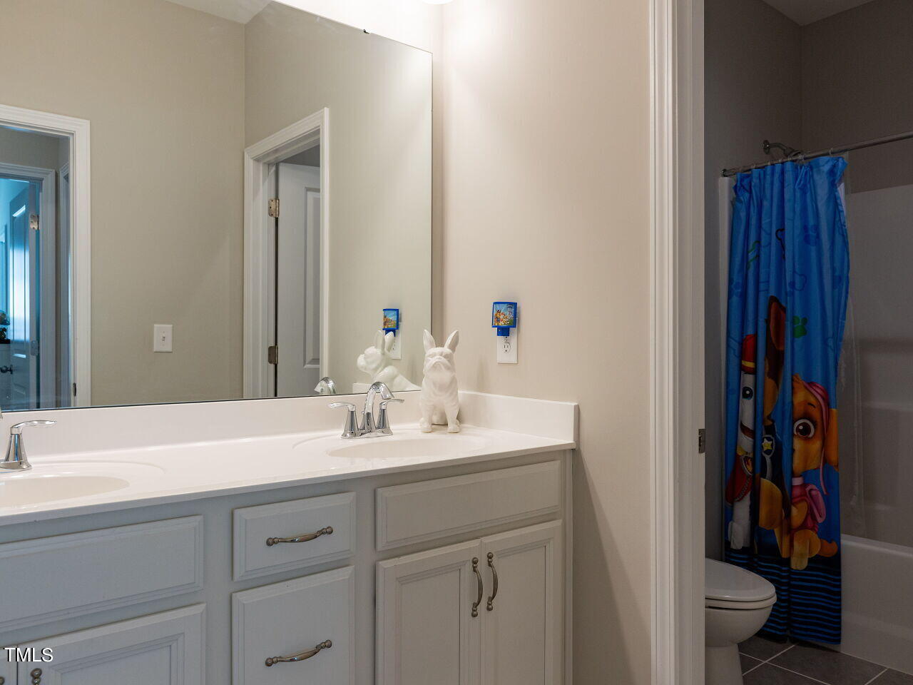 605 White Oak Pond Road Apex, NC 27523 - Photo 34 of 46 a bathroom with a sink and a mirror