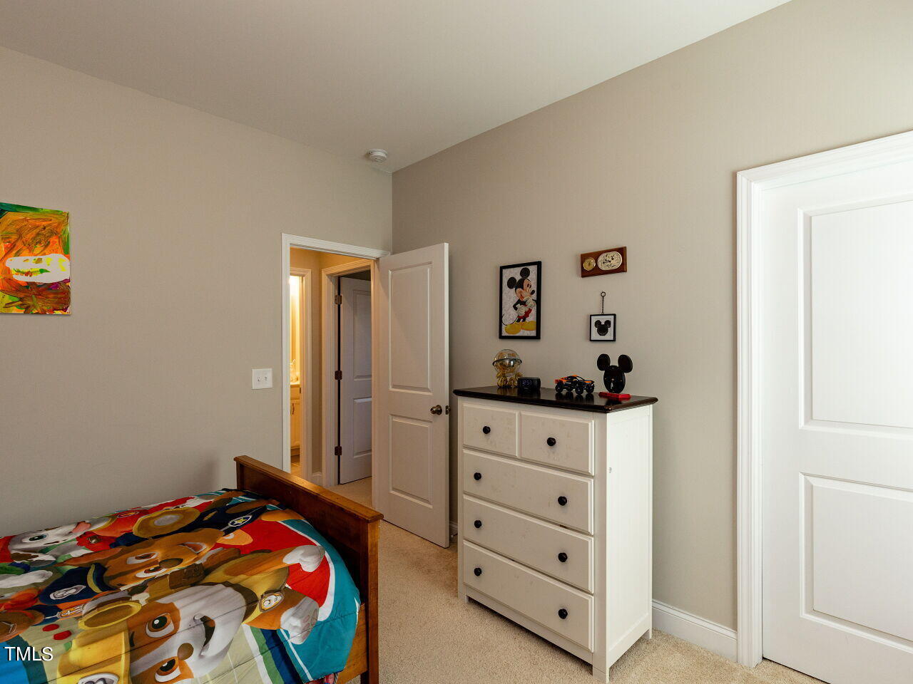 605 White Oak Pond Road Apex, NC 27523 - Photo 36 of 46 a bedroom with a bed and a dresser