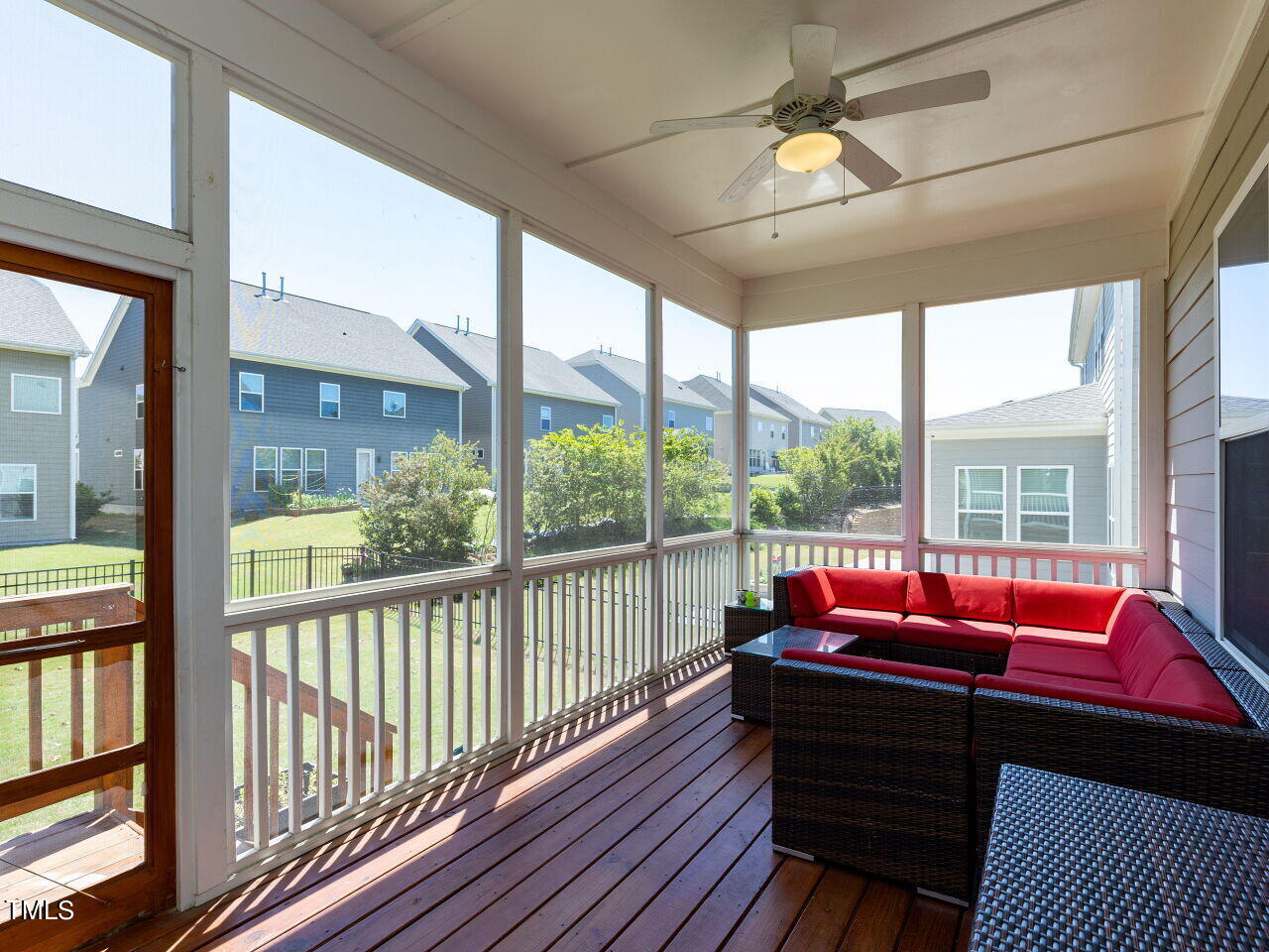 605 White Oak Pond Road Apex, NC 27523 - Photo 37 of 46 a living room with furniture and a floor to ceiling window