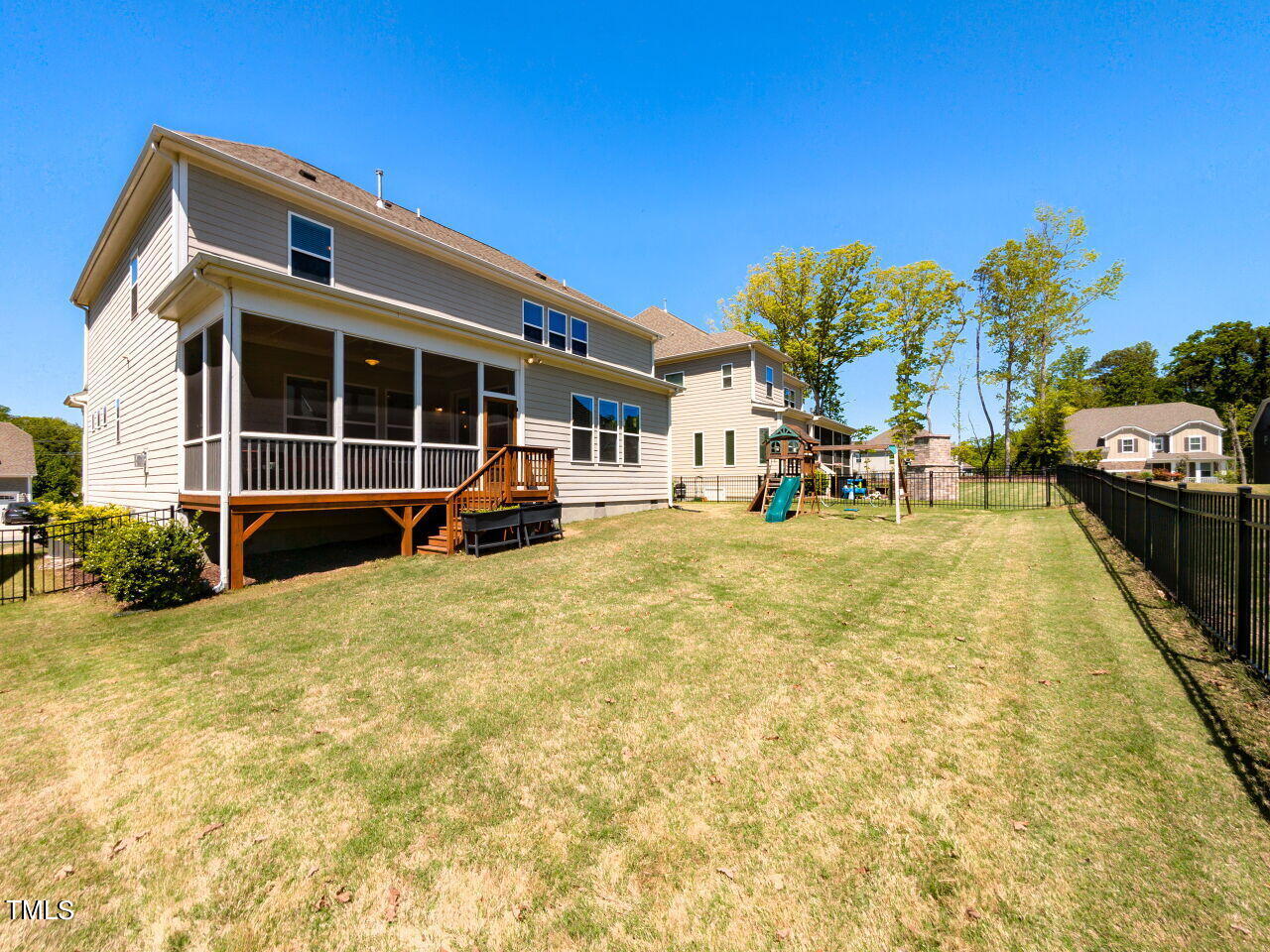 605 White Oak Pond Road Apex, NC 27523 - Photo 38 of 46 a view of a house with backyard and sitting area