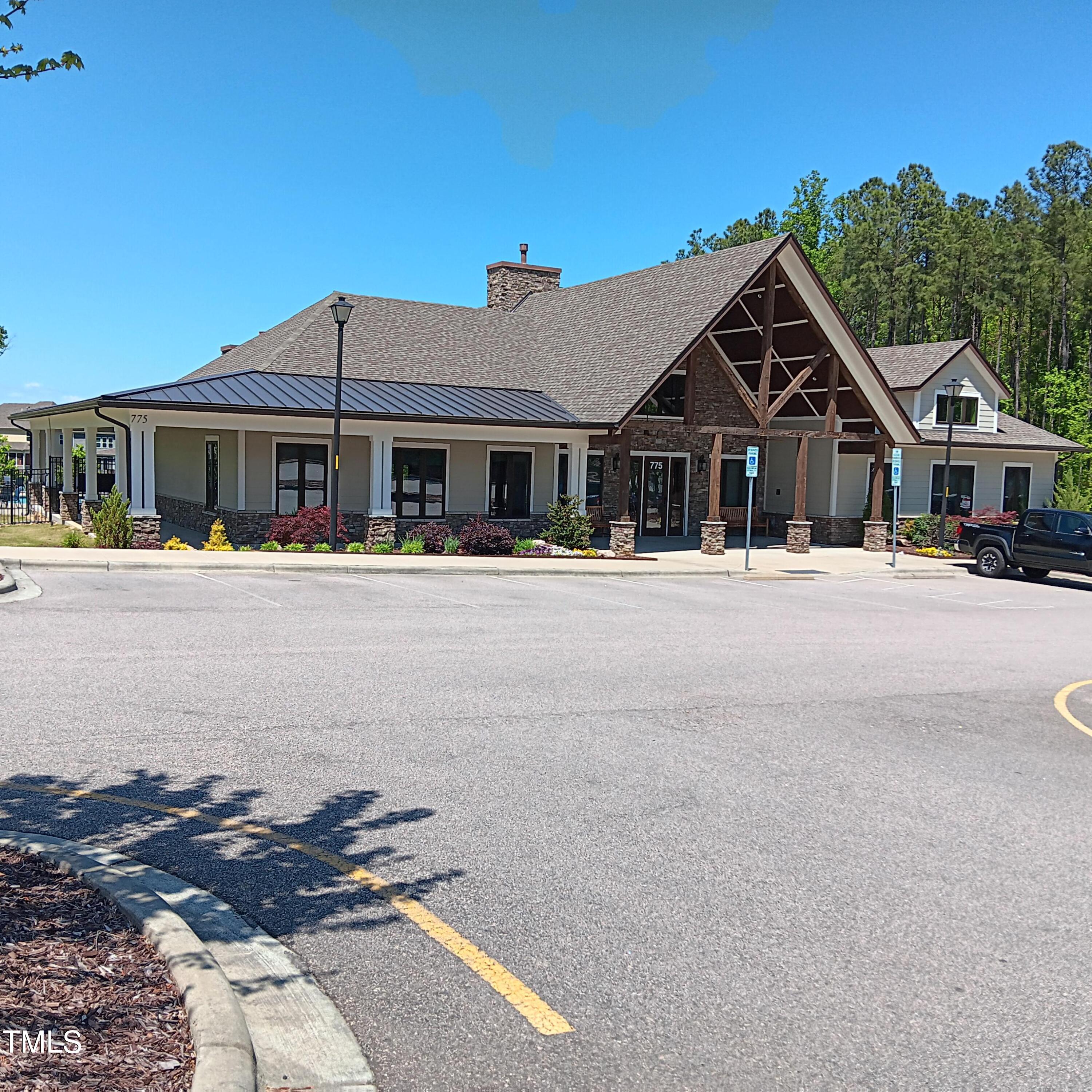 605 White Oak Pond Road Apex, NC 27523 - Photo 41 of 46 a front view of a house with a yard